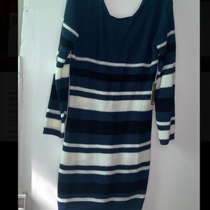 This is a knitted dress with a low cut back and Long sleeves.